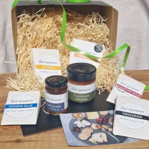 Artisan cheese hamper in eco friendly packaging.